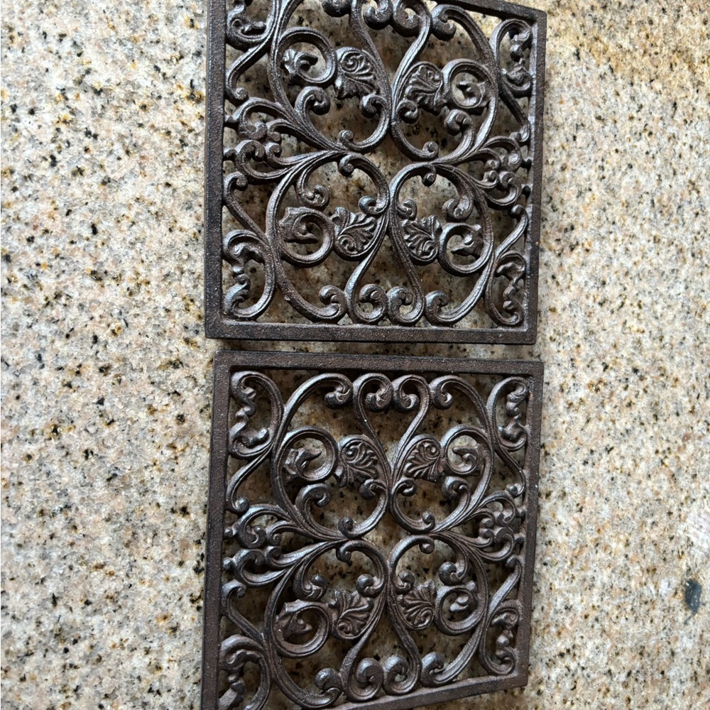 Iron trivets (2) one is missing the bottom plastic